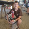 Reid Jacob shows off the fair's top turkey, Houston.